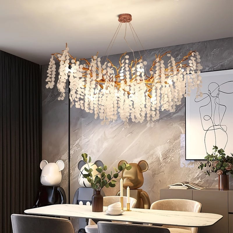 Lustre à branches en cuivre et cristaux